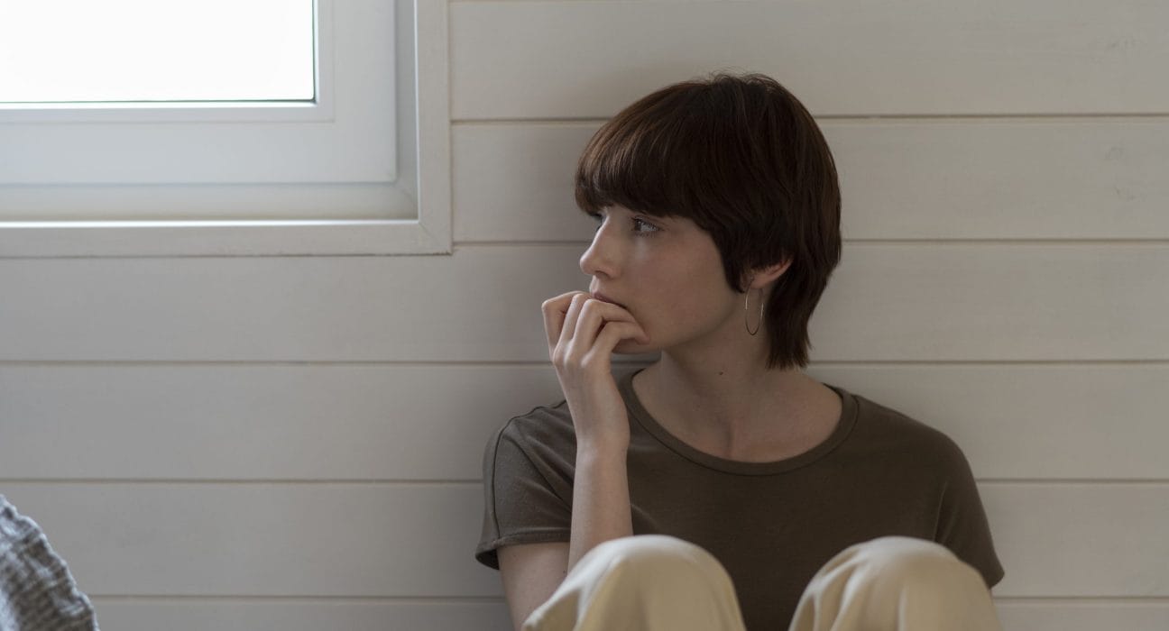 medium-shot-young-woman-sitting-floor